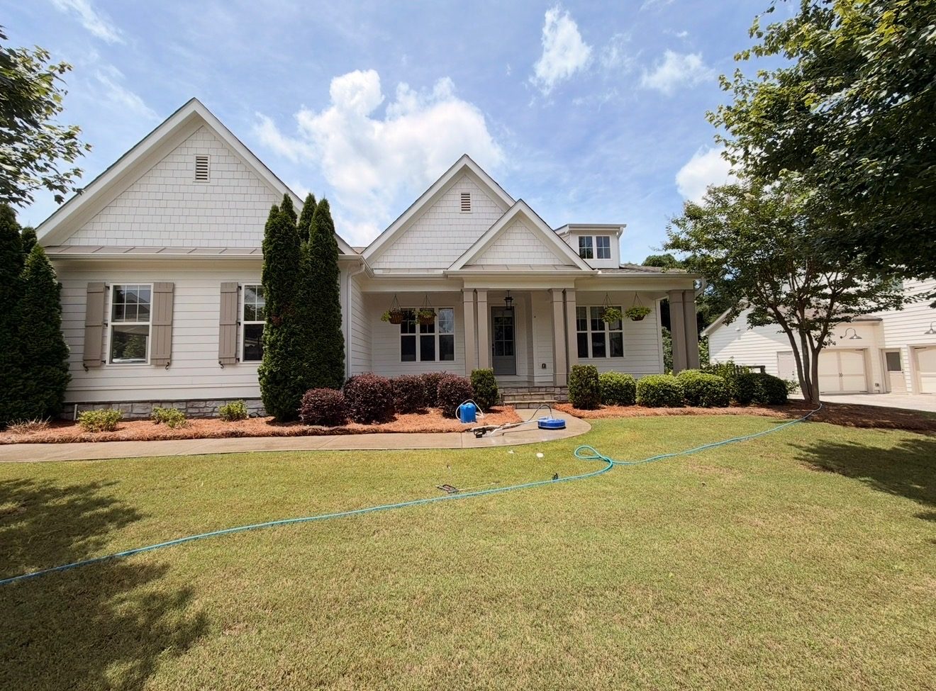 A freshly soft-washed home in North Georgia under a blue sky
